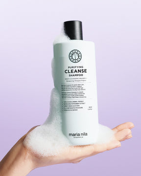 Purifying Cleanse shampoo bottle with lather 