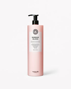 Pink bottle of Maria Nila Mirror Gloss Conditioner Liter on a white background